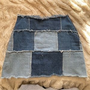 Distressed denim patch mini skirt